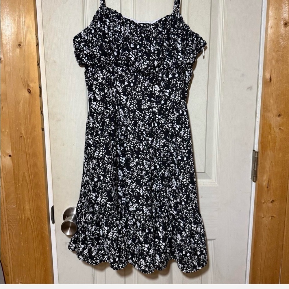 This is a Pamela X NA-KD ditsy floral black and white milkmaid summer dress